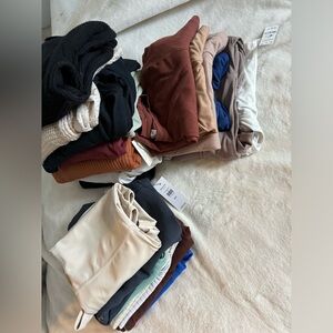 Women’s bulk of shirts, and bodysuits. Worn once, or brand new with tags.